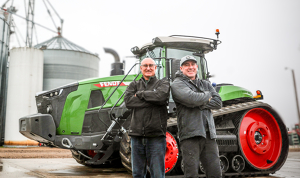 2 Farmers in front of their Fendt Track Tractor