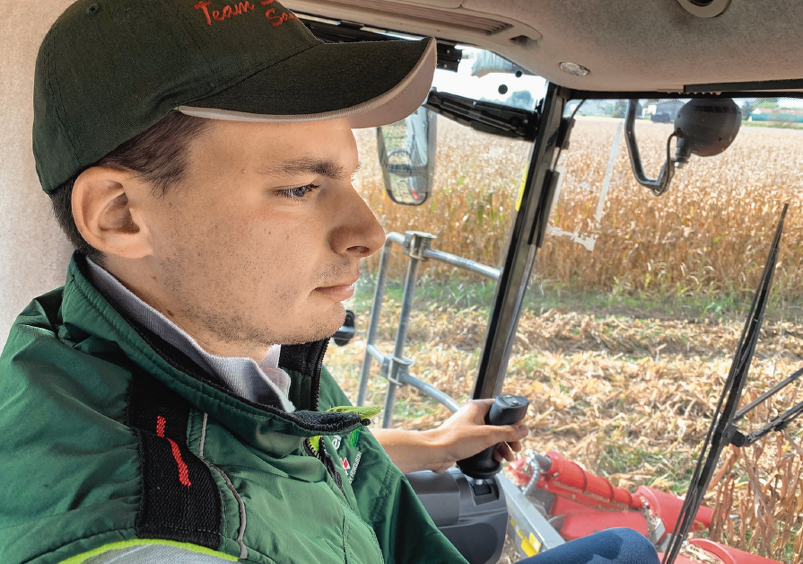 Close-up of Andrea Sandrini in the cab of a Fendt IDEAL T8.
