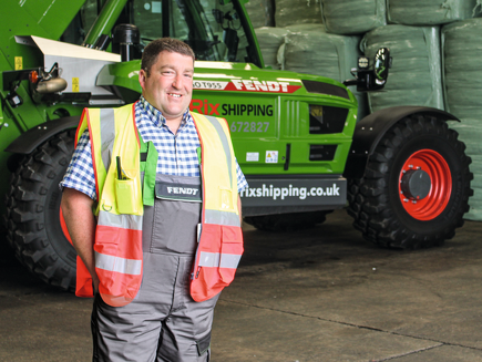 Mark Cessford is standing in front of his Fendt Cargo T 955