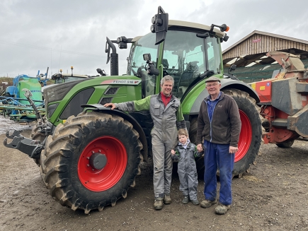 John Whiteford stands proudly with his son and father in front of a Fendt 516 Vario.