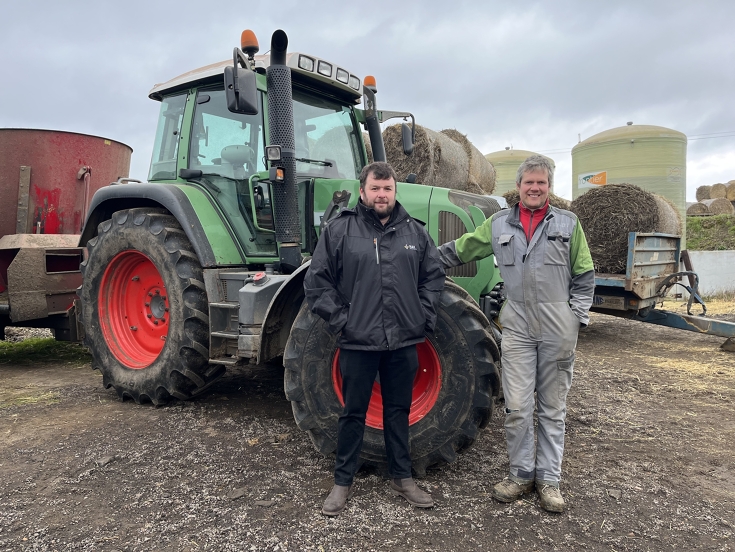 Steven Player and John Whiteford stand in front of a Fendt tractor