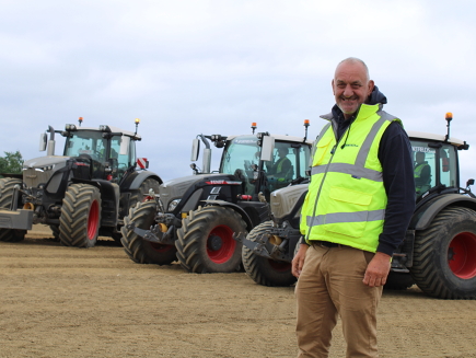 Geoff Collins stands in front of his Fendt tractors